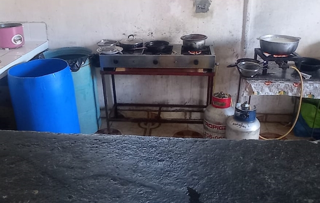 Ministry of Health inspectors examining and removing prepared food from a small fonda kitchen in Chiriquí ahead of Carnival