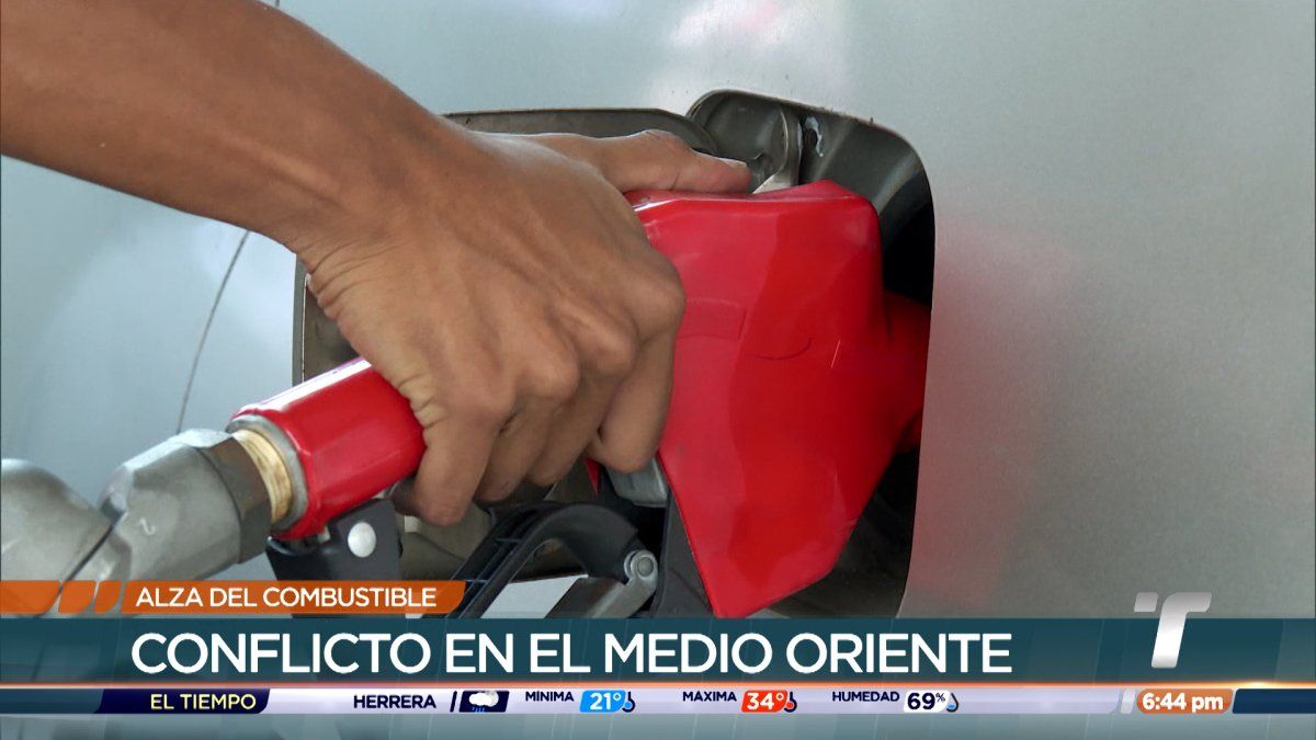 Fuel pumps and a gas price display at a Panamanian service station showing high prices