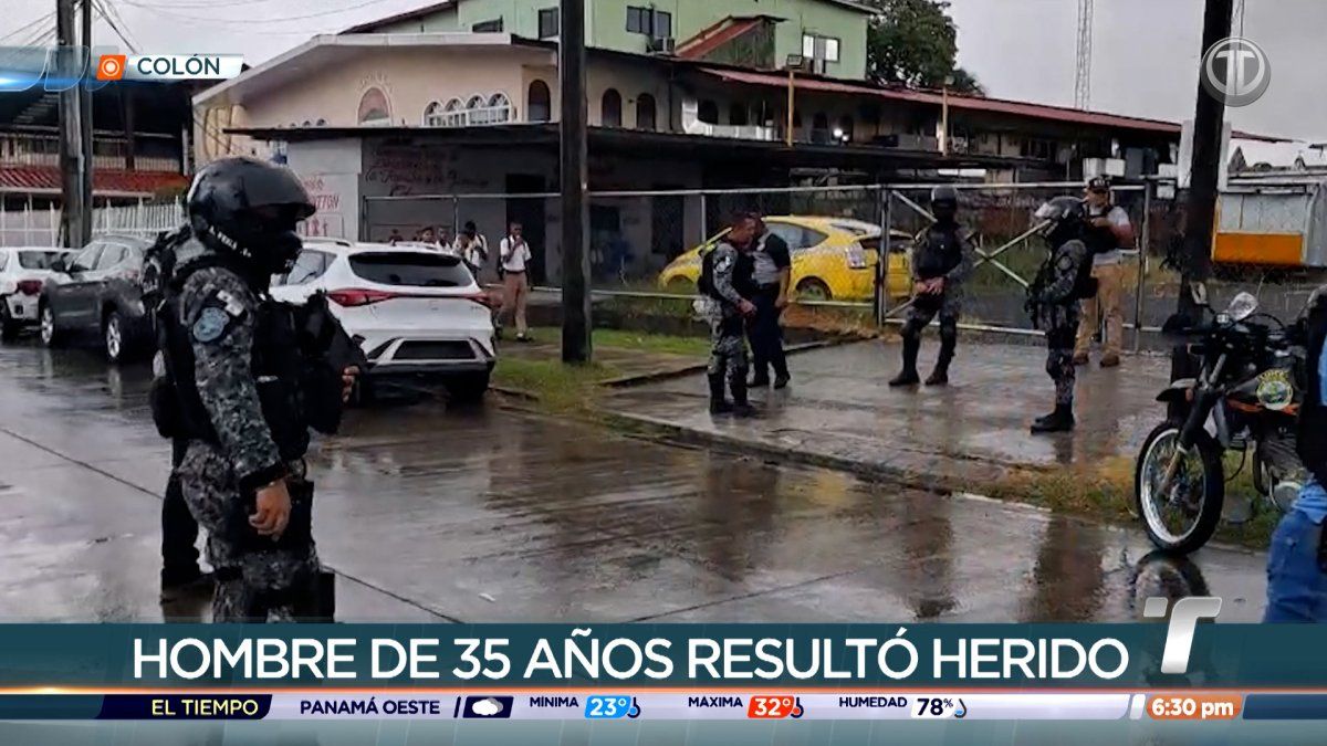 Street scene in Colón city where a man was reportedly shot, showing buildings and pedestrians