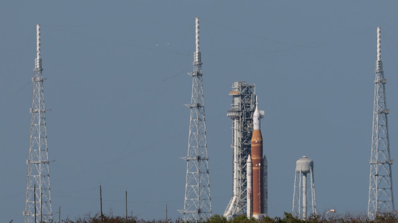 A NASA Space Launch System rocket stands on the launch pad ahead of a historic moon mission