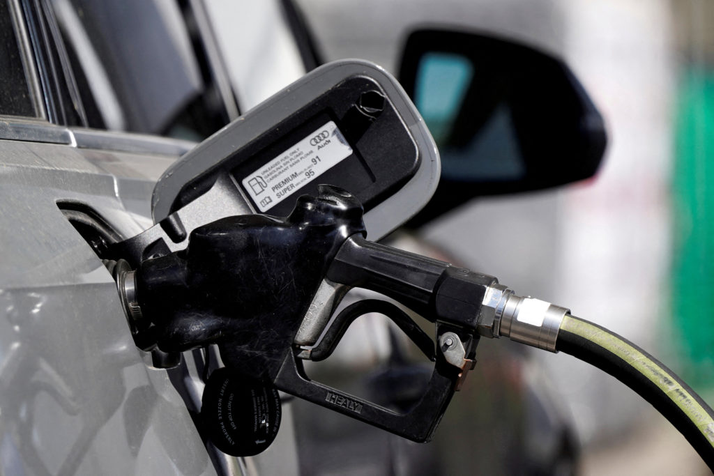 A gas pump price display and an image suggesting tax legislation and refunds, illustrating rising pump costs offsetting tax refund gains