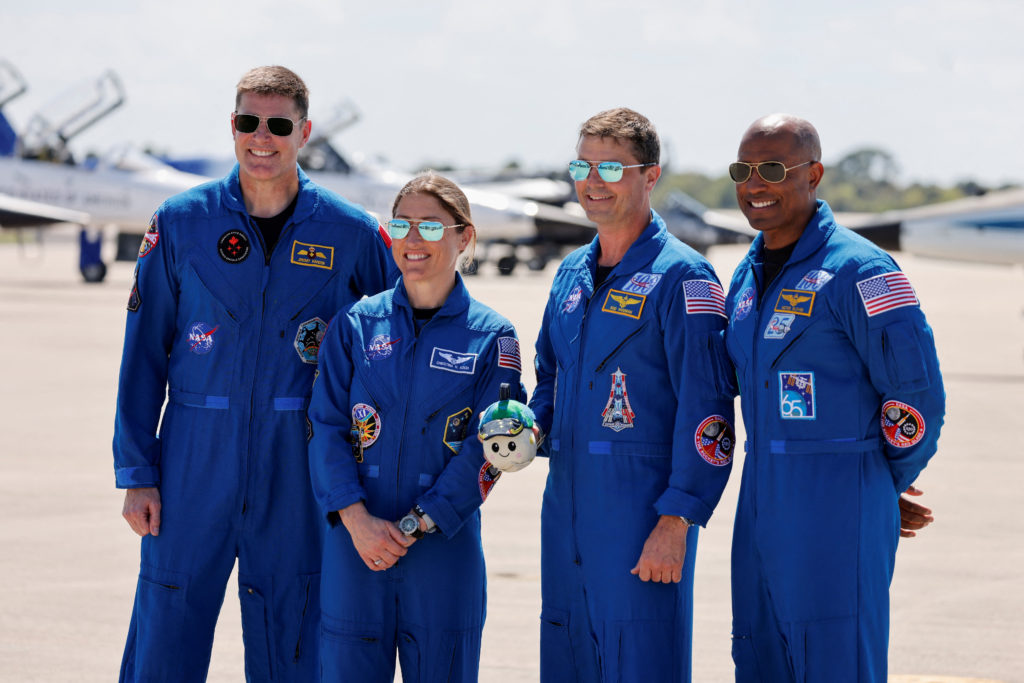 A NASA Artemis astronaut team portrait showing crew members prepared for a new Moon return mission