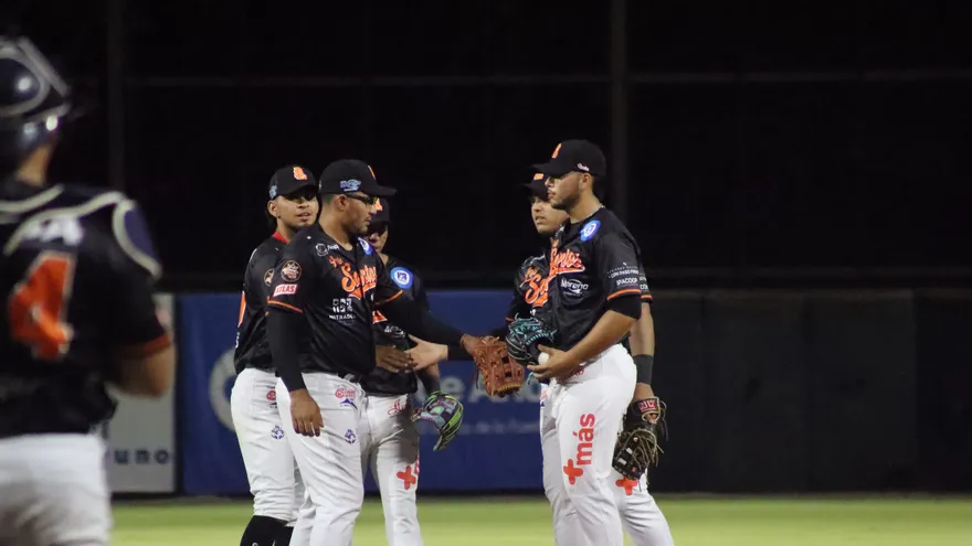 Baseball players and fans at the coliseum in Las Tablas as officials stop a suspended match