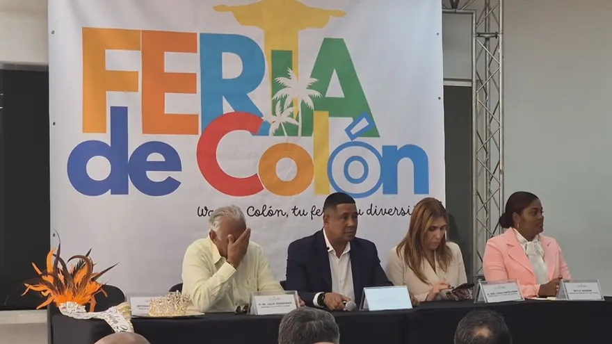 Families and food stalls at a Feria de Colón event showcasing local gastronomy and cultural traditions
