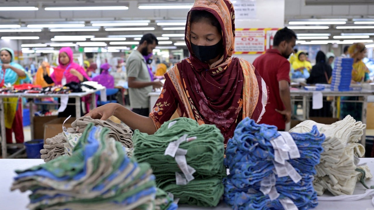 Garment factory floor with rows of sewing machines and workers, illustrating Bangladesh’s clothing export industry
