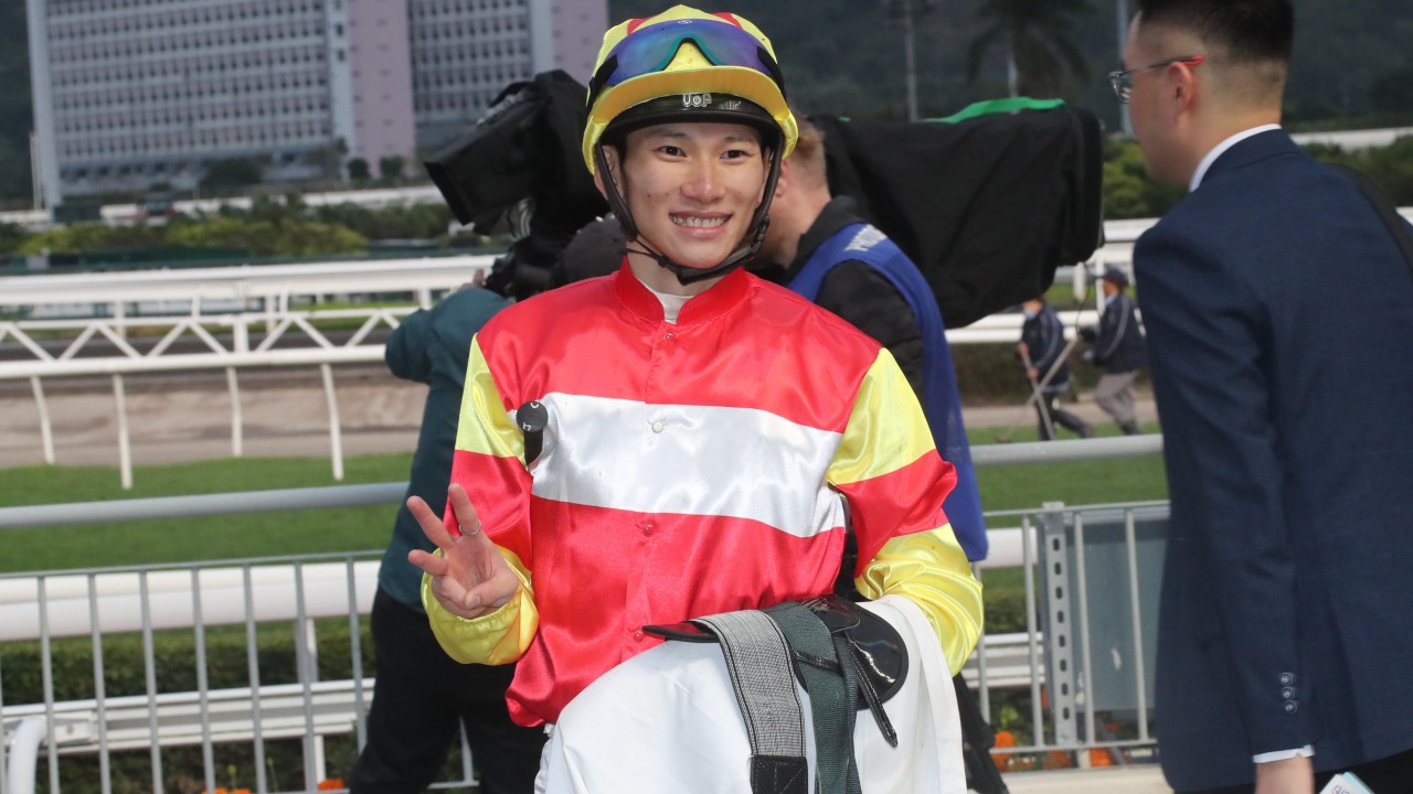 Jockey Jerry Chau in racing silks aboard a racehorse preparing for a race, representing the upcoming Chairman’s Trophy mount on Voyage Bubble