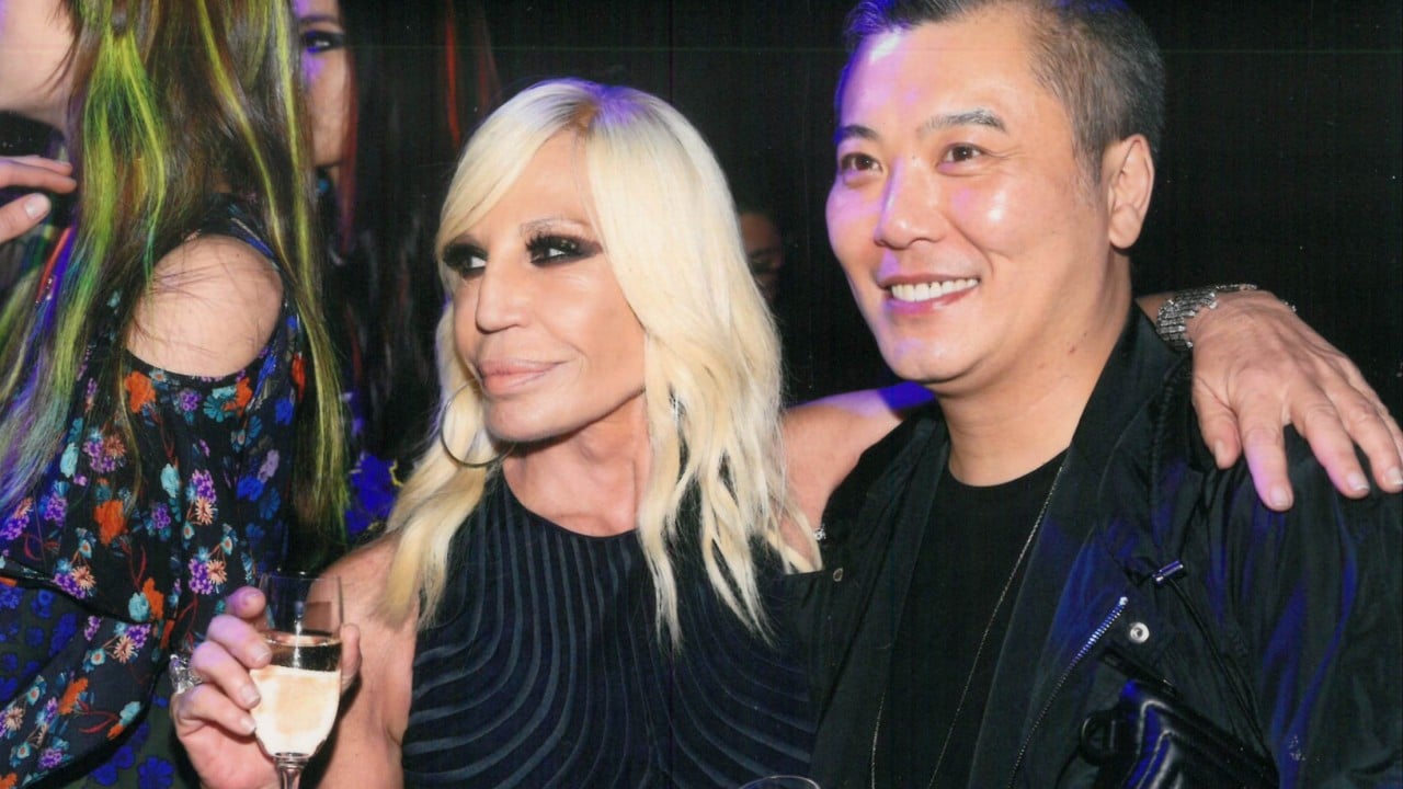 Peter Cheung at a fashion event, a well-dressed man pictured at a luxury show or boutique