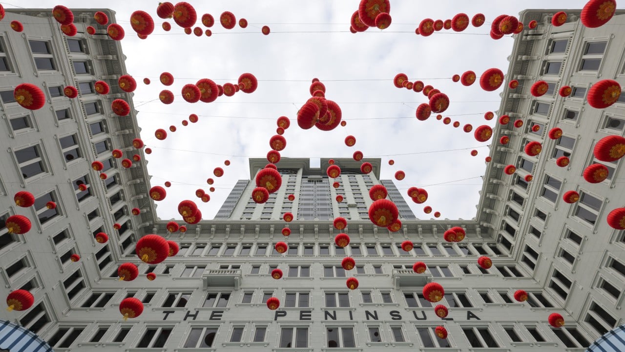 A Hong Kong skyline with business travelers and hotel buildings, reflecting rising Middle Eastern interest in the city.