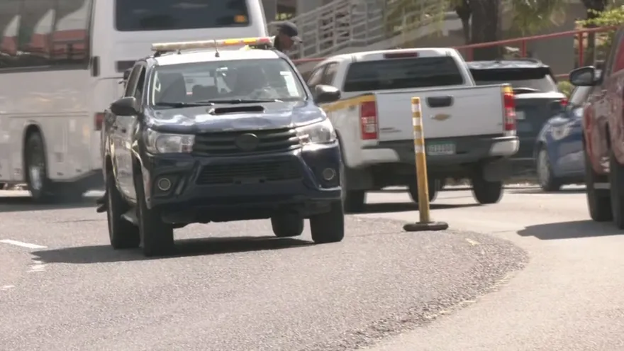 Vehicles moving along a major highway in Panama with traffic control measures in place during the Easter holiday