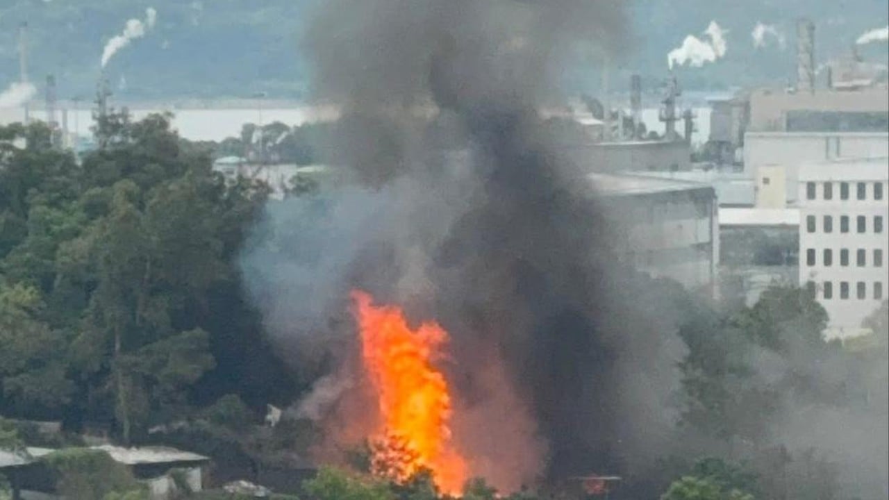 Flames and thick black smoke rising from a recycling yard in Tai Po after an explosion