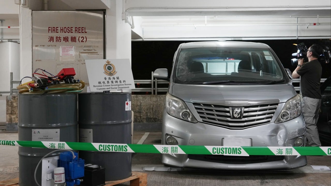 Vehicle at night modified with an enlarged fuel tank being refueled discreetly, illustrating illicit petrol sales in Hong Kong