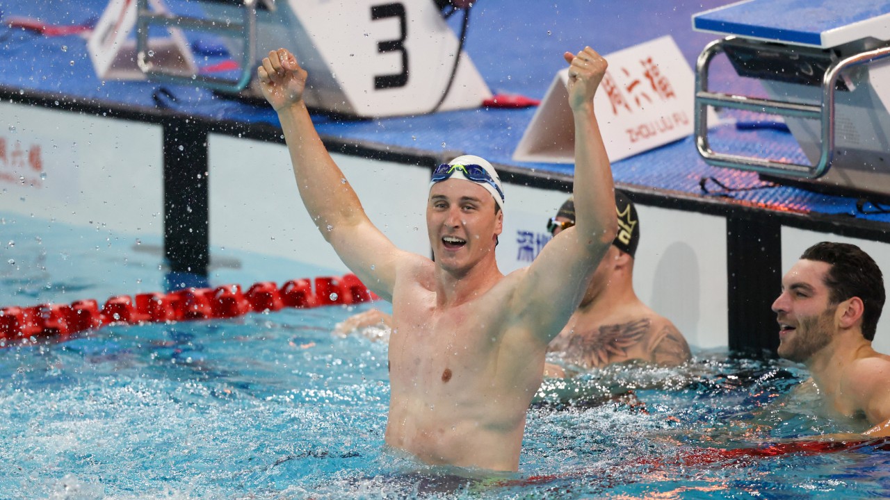 Cameron McEvoy in competition swim gear in a pool, celebrating after the China Open 50m freestyle race