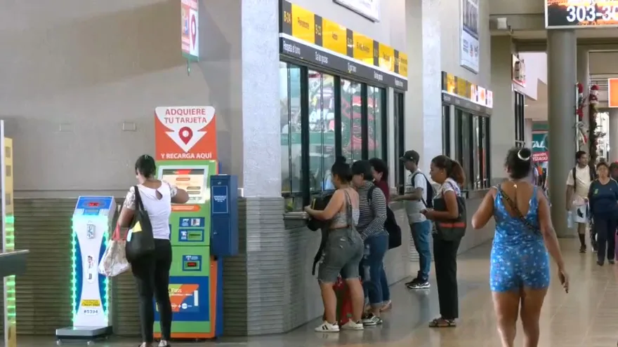 Travelers moving through the Albrook bus terminal in Panama City during a busy holiday period
