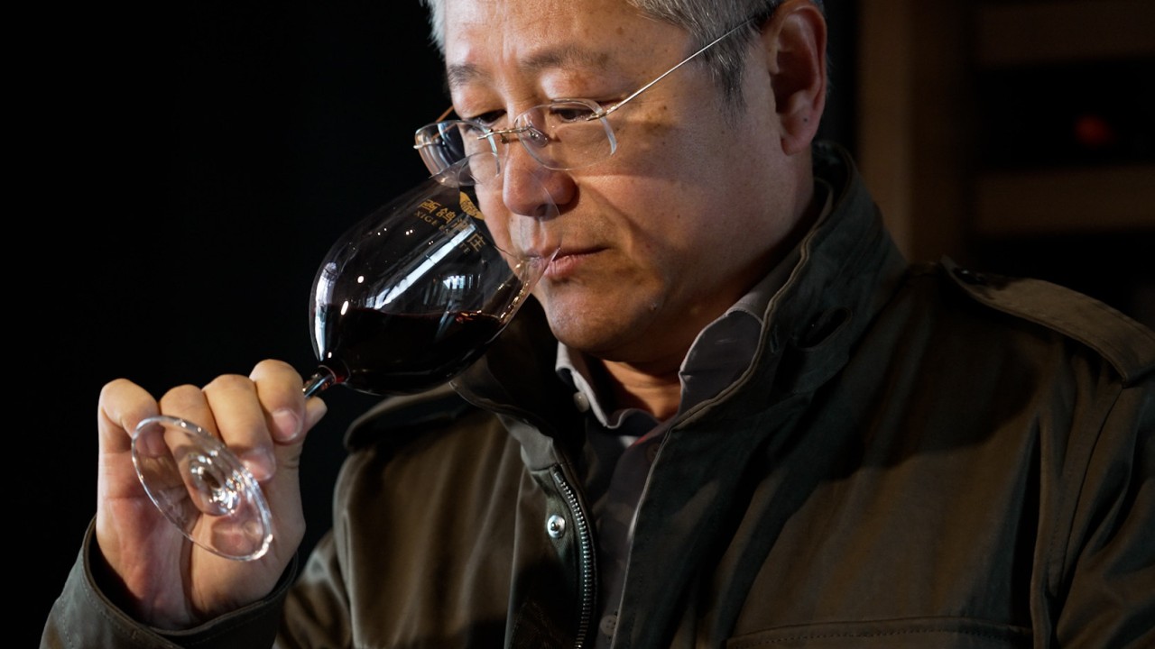 A bottle of Chinese red wine labeled for Ningxia, with a vineyard-like background suggesting the region’s growing wine industry