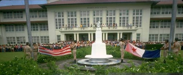 Balboa High School in the former Canal Zone with a flag-raising ceremony and a school building in the background