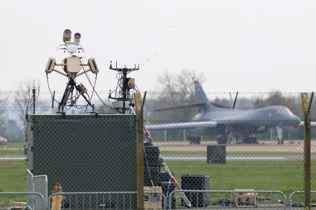 Aerial view of an Air Force base in Louisiana with security alert imagery suggesting unmanned drone threats