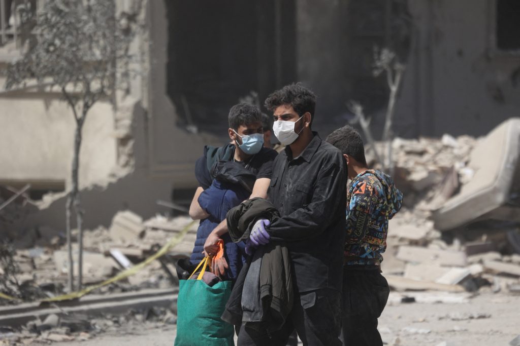 City lights over Tehran dimming during a power outage at night