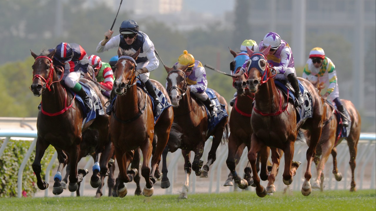 Horses and jockeys sprinting toward the finish line at the BMW Hong Kong Derby at Sha Tin racecourse