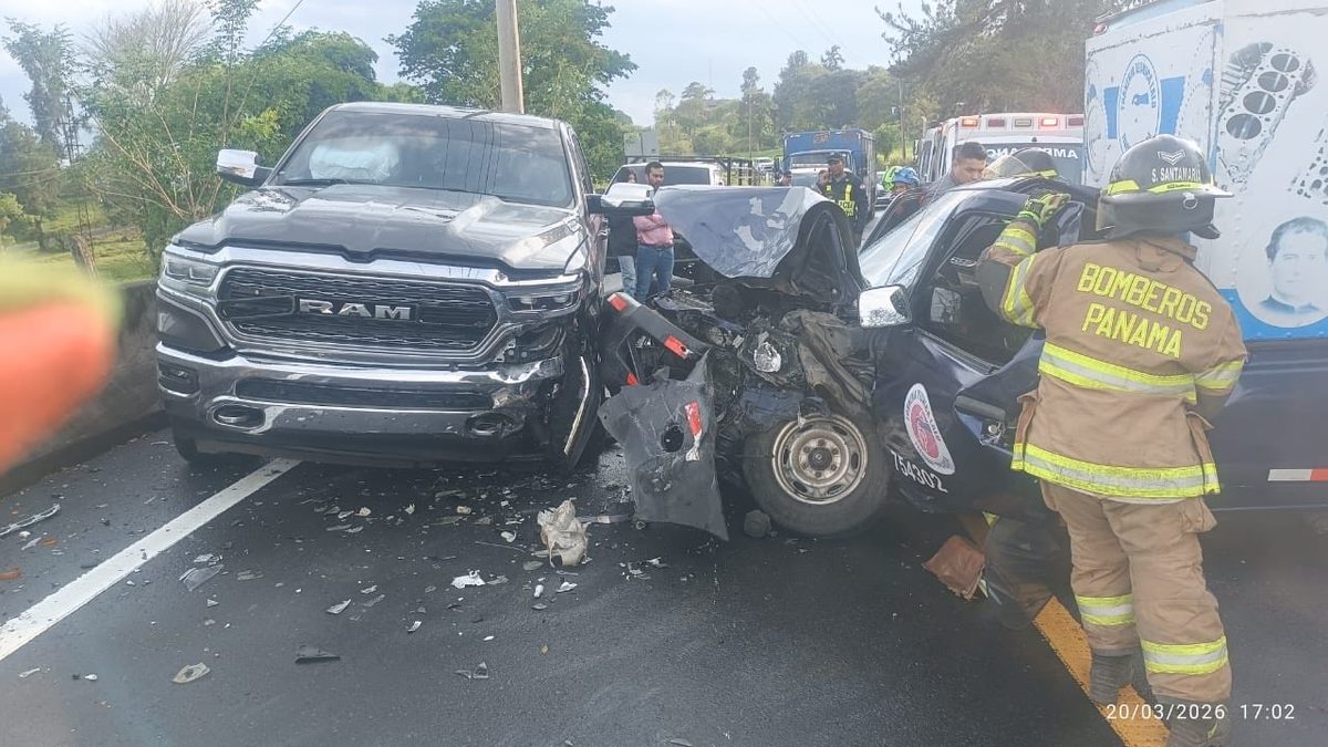 Firefighters using hydraulic rescue tools at the scene of a pick-up collision on a rural road in Bugaba, Chiriquí