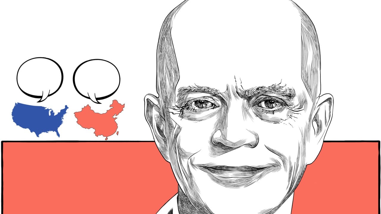 Portrait of William Klein, former US diplomat, against a blurred background suggesting an international or embassy setting