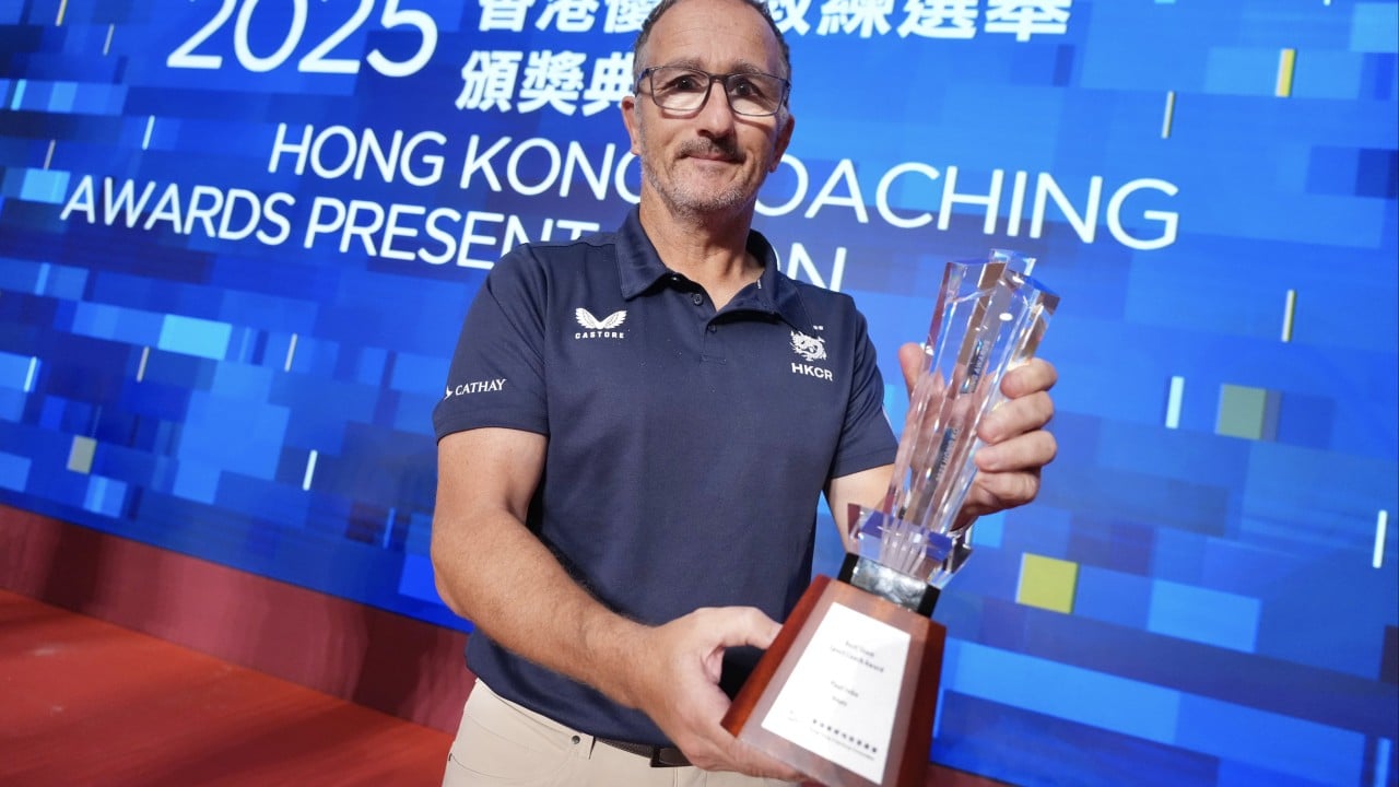 Paul John being honored at the Hong Kong Coaching Awards with Hong Kong men's rugby sevens team success implied