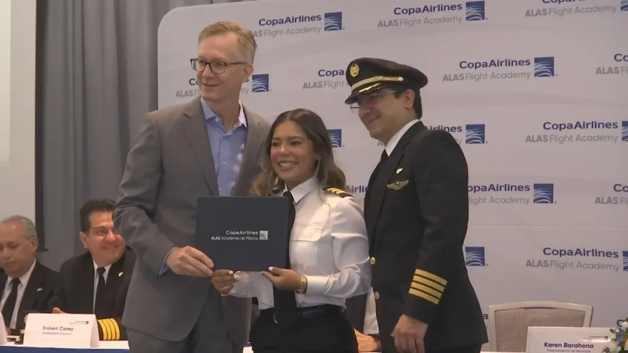 Group of newly graduated pilots from the ALAS academy at a graduation ceremony