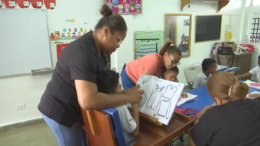 Panamanian students in a classroom listening attentively, representing diverse backgrounds and aspirations
