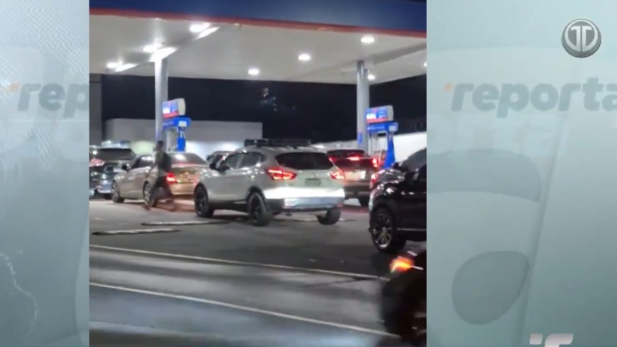 Fuel pumps and a price display showing updated gasoline prices at a Panama gas station
