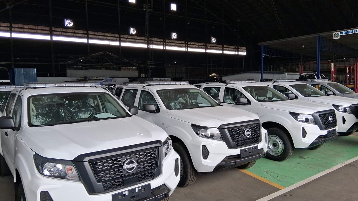 Line of new pickup-style police patrol vehicles with Policía Nacional markings parked outdoors