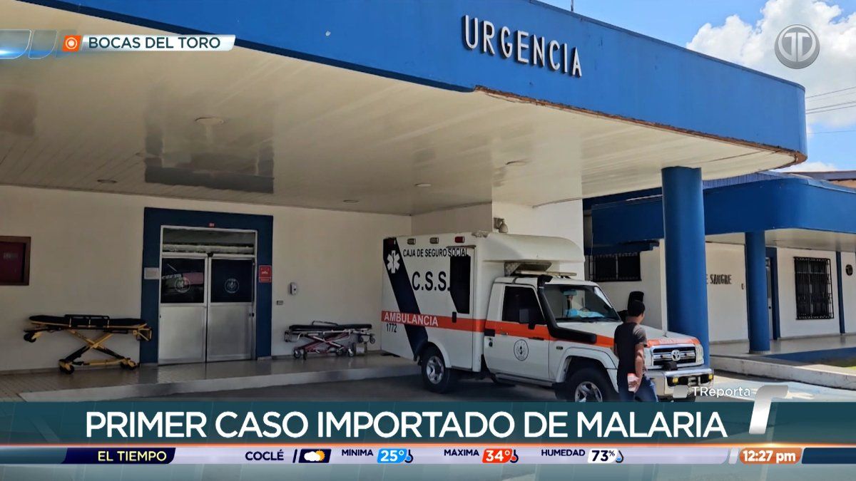A public hospital entrance in Bocas del Toro with health workers or patients nearby