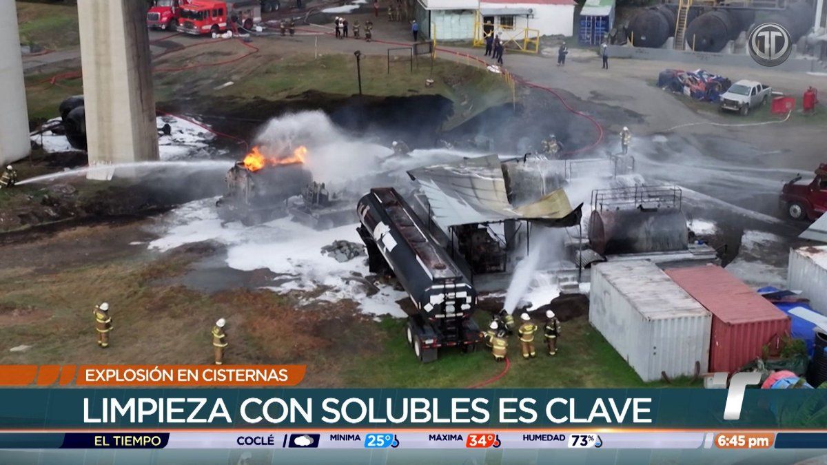 Tanker trucks and fuel tanks beneath the Bridge of the Americas in Panama City