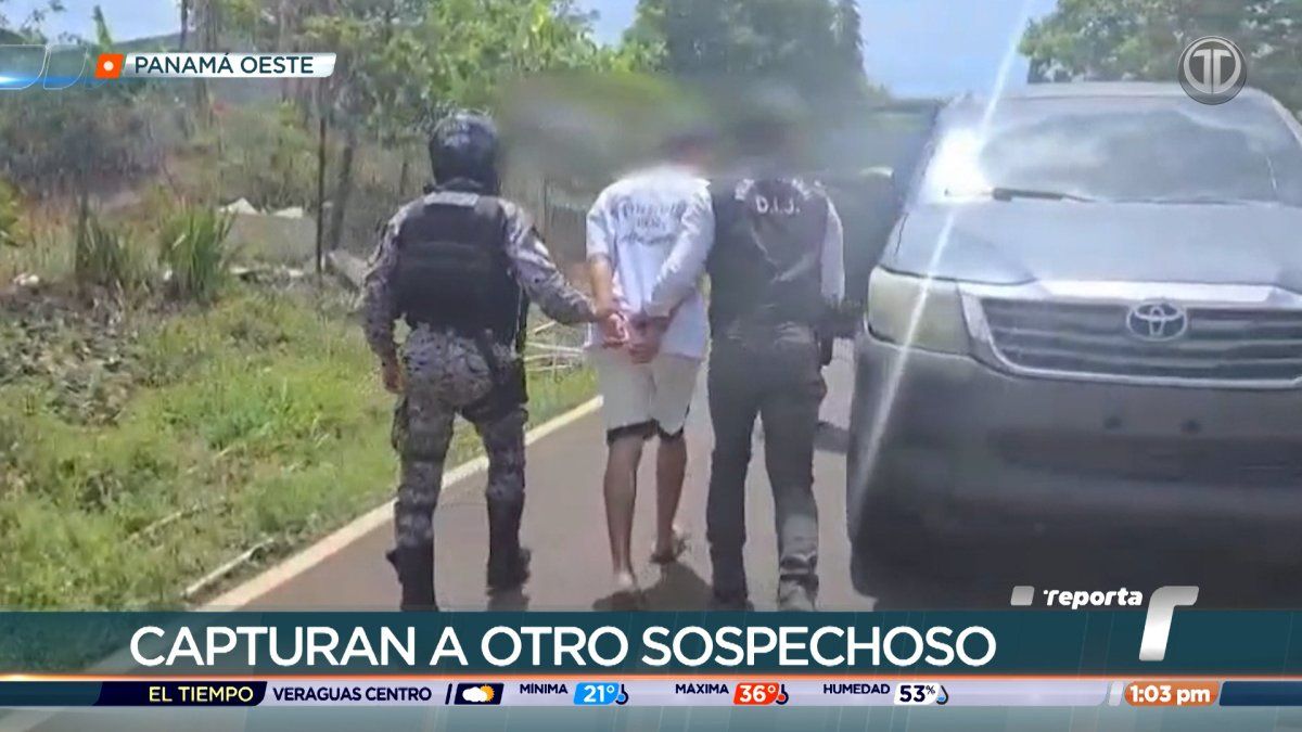 Police vehicle and investigators in a neighborhood street in La Chorrera, Panama, during an arrest operation