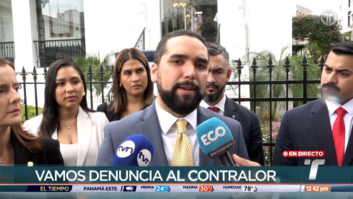 Panamanian lawmakers speaking outside a government building after filing a complaint against the comptroller