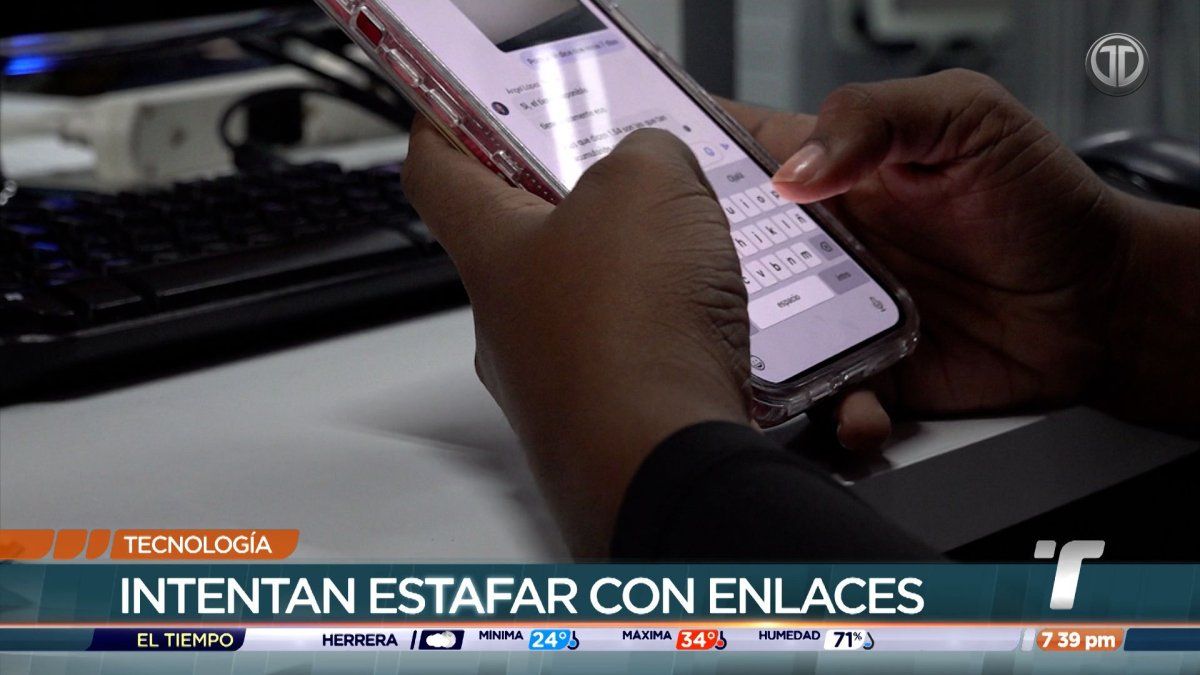 A person looking at a mobile phone displaying a suspicious text message with a warning symbol beside it