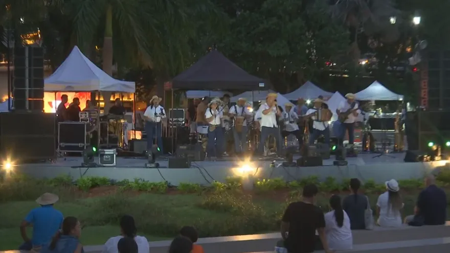 People gathering in Panama City's Casco Antiguo during a lively outdoor cultural event with historic buildings nearby