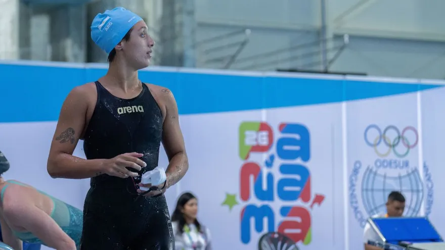Young athletes competing at the South American Youth Games in Panama with spectators and broadcast cameras nearby