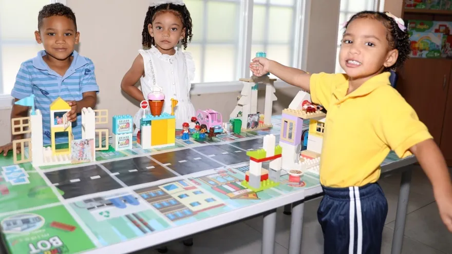 Teacher guiding three-year-old children through a playful learning activity in a CAIPI classroom in Panama