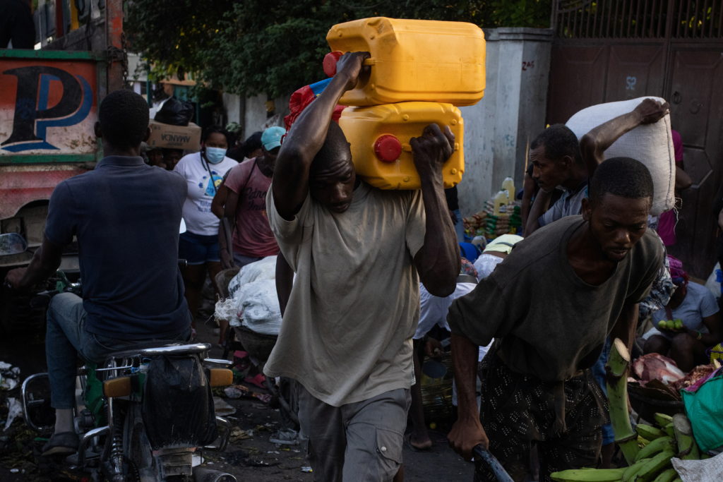 Workers protesting in Port-au-Prince demanding higher wages amid rising fuel costs