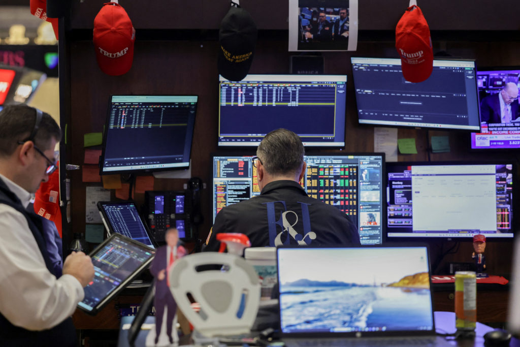 Traders on the floor of the New York Stock Exchange as oil prices surge amid Middle East conflict fears