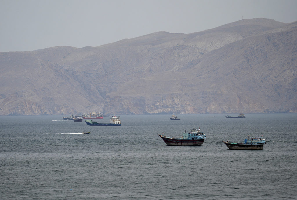 A military vessel near the Strait of Hormuz as ships navigate a key oil shipping route