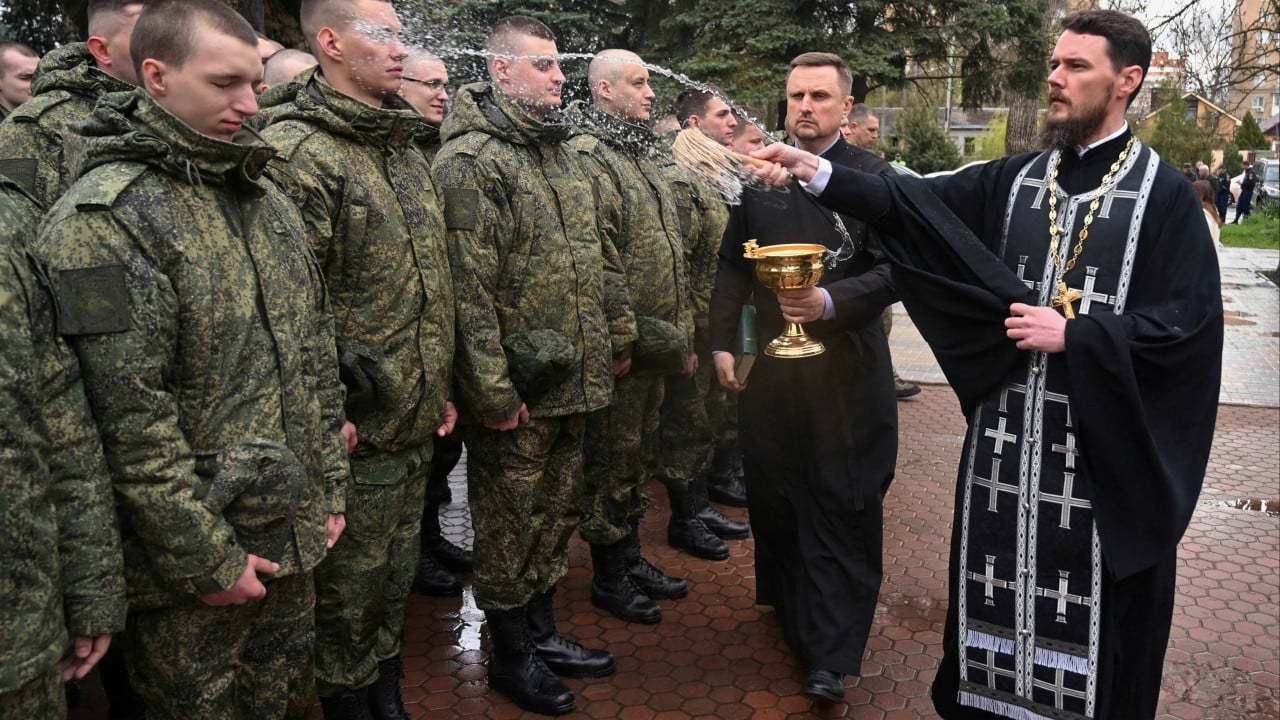 Soldiers and damaged buildings in a war zone as the Russia-Ukraine ceasefire ends