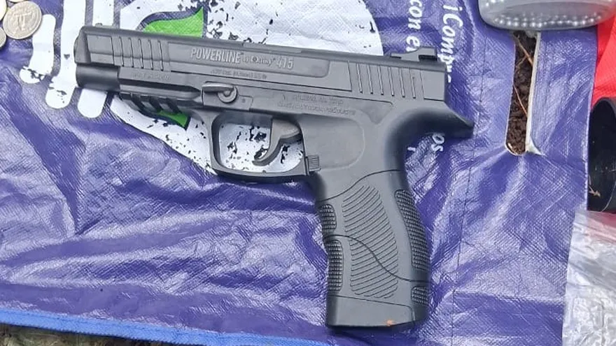 Police officers inspecting a vehicle at a roadside checkpoint in La Chorrera, Panama Oeste
