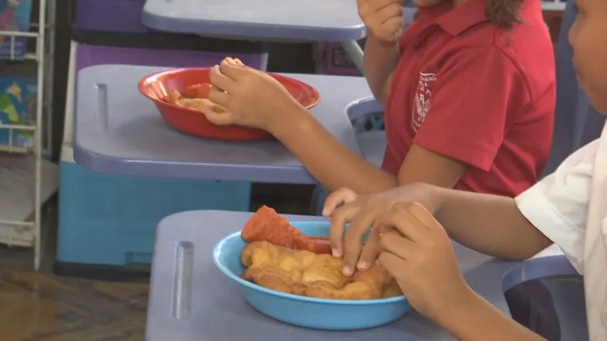 A community kitchen setting in San Miguelito with food being prepared for local families