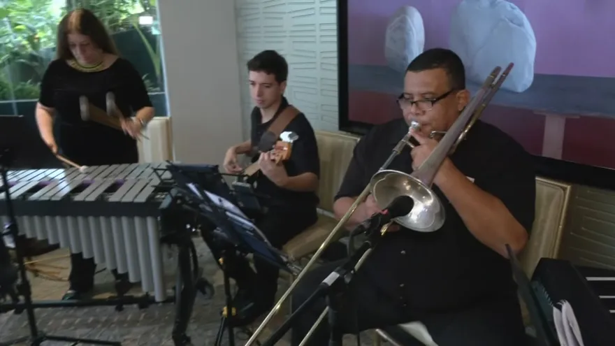 Musicians performing jazz on an outdoor stage in Pedasí with a crowd gathered for a cultural event
