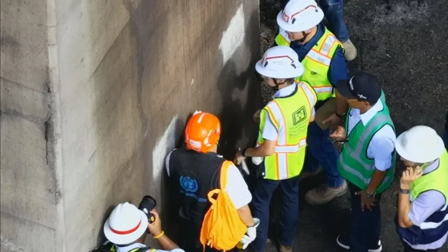 Engineers inspecting the Bridge of the Americas spanning the Panama Canal in Panama City