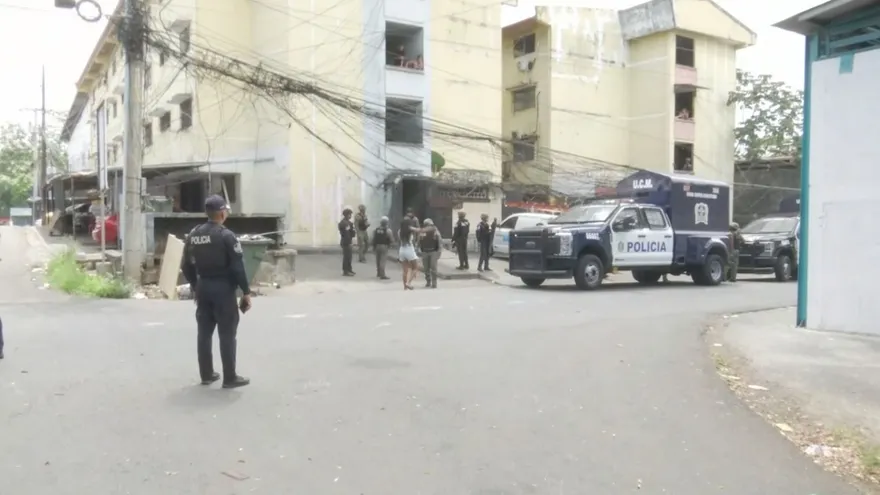 Police officers responding in a residential area of Río Abajo where an abandoned infant was found inside a flooded room