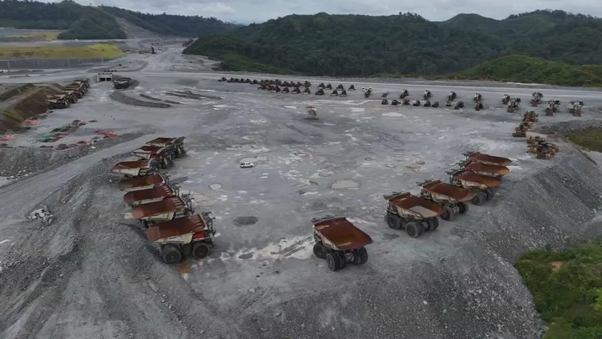 Workers or officials overseeing copper material at a mine site in Panama during environmental cleanup efforts
