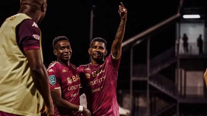 Fidel Escobar and Tomás Rodríguez in Deportivo Saprissa colors celebrating a championship victory