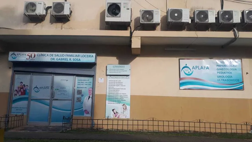 A medical consultation setting in Panama where a man discusses a vasectomy with a health professional