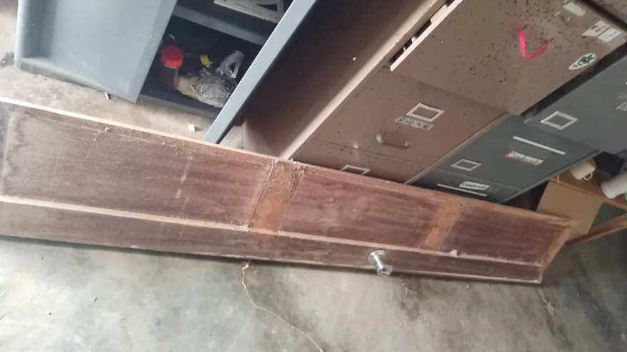 Damaged furniture and medical equipment inside a community health post in Cerro Puerco